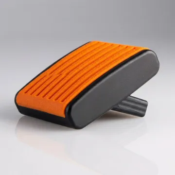 Precision overmolded plastic component showing rubber grip over rigid plastic substrate