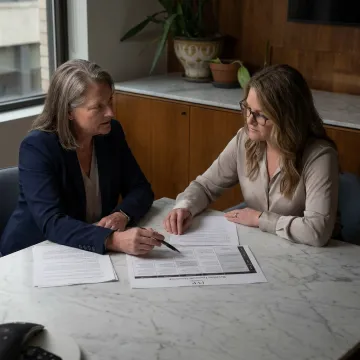 Business coach guiding woman founder through strategy