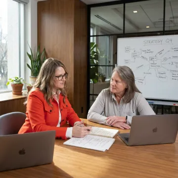 Leadership coach advising a small business owner