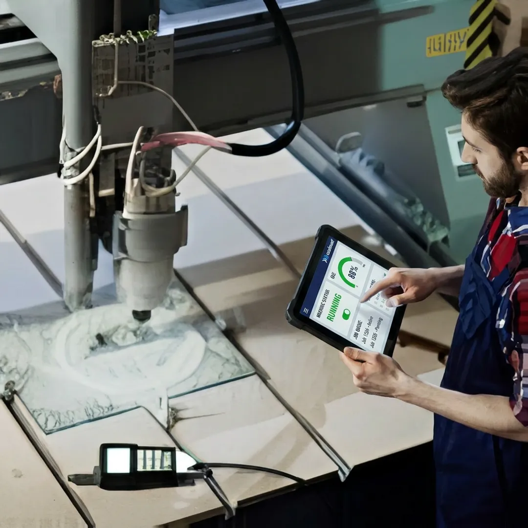 Operator updating job progress on a shop floor tablet