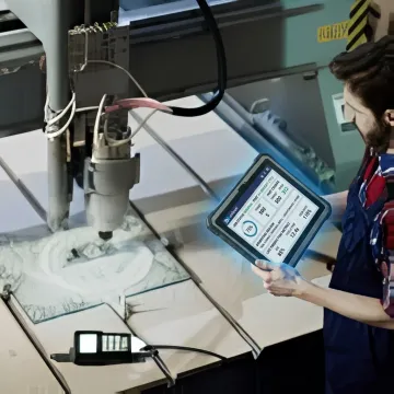 Operator using a tablet HMI on a manufacturing shop floor