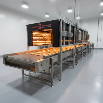 Food-grade infrared conveyor equipment in a processing facility