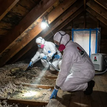 Certified remediation crew inspecting a home for mold and asbestos