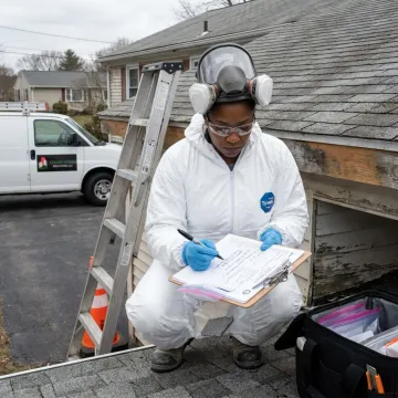 Inspector documenting asbestos roof samples for lab testing