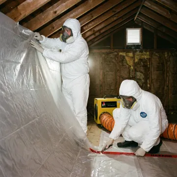Crew preparing an attic for insulation upgrades