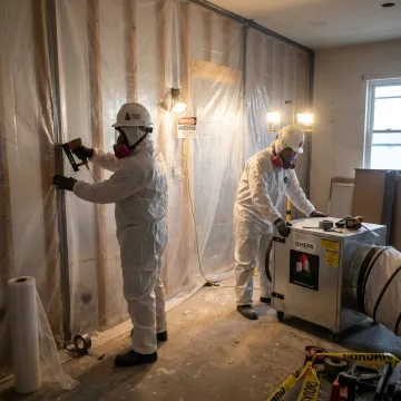 Asbestos containment setup with HEPA filtration