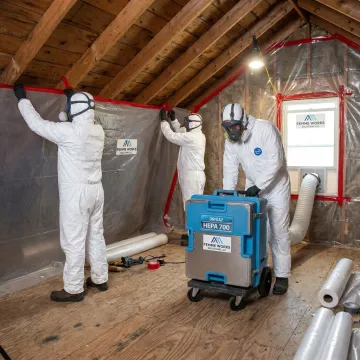 Attic remediation team setting up containment