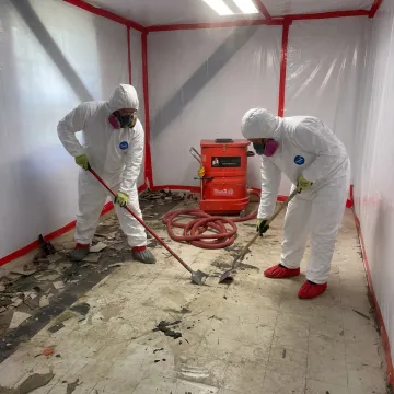 Certified asbestos floor abatement on concrete