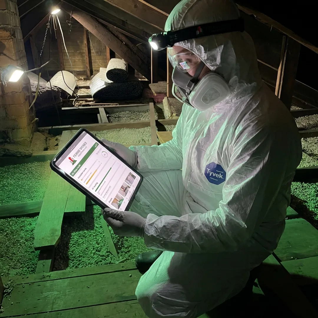 Technician documenting remediation work for rebate support