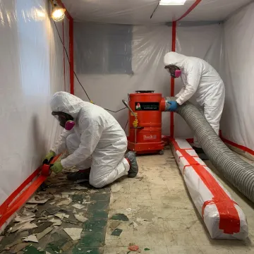 Asbestos containment setup before flooring removal