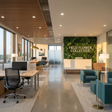 Modern office renovation featuring custom workspaces and brand-aligned interior design