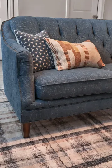 Designer selecting fabric swatches and material samples for luxury home