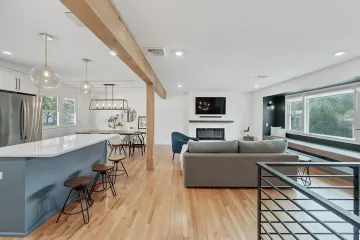 Elegant modern living room with curated furniture and natural lighting in St. Johns County home