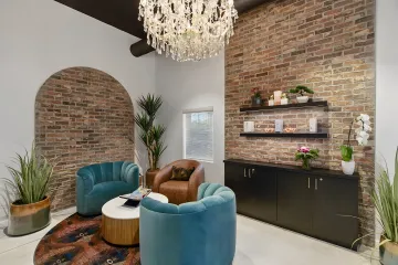 Professional interior designer consulting with Indianapolis client in modern living room