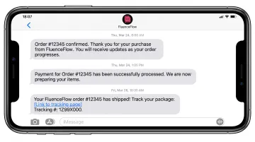 Mobile phone displaying transactional SMS order confirmation and shipping notification messages