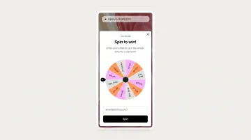 Gamified spin-to-win wheel popup interface on mobile device screen