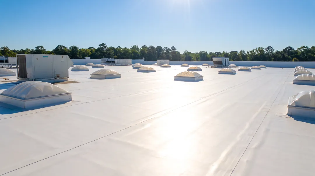 White TPO roofing membrane installed on commercial flat roof
