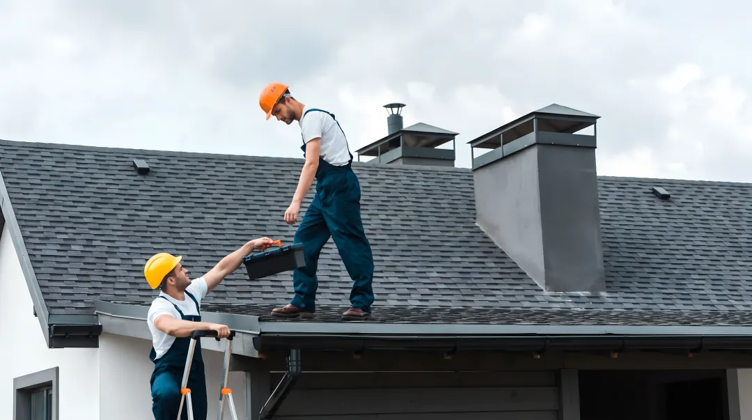 Master Elite certified roofing crew installing impact-rated shingles