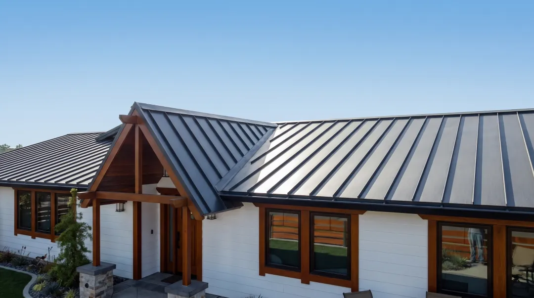 Standing seam metal roof panels installed on modern residential home