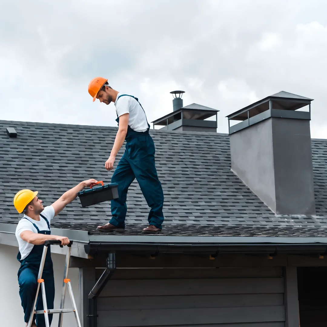 Roofers installing a durable shingle roof