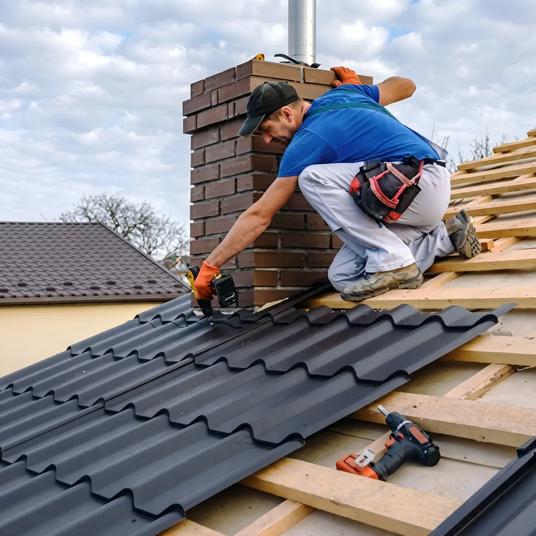 Roofing professional installing metal roof panels