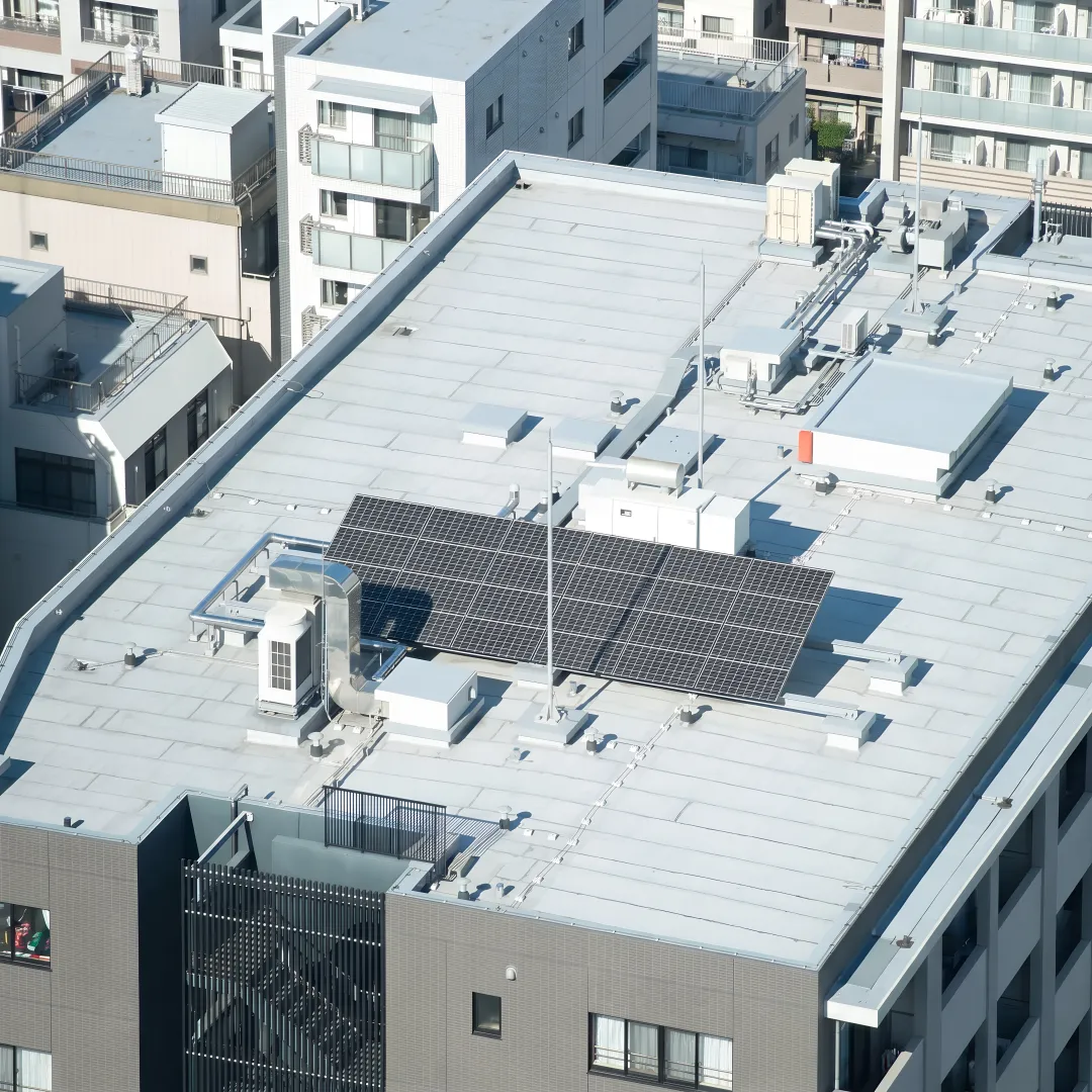 Roofing crew installing a flat roof system