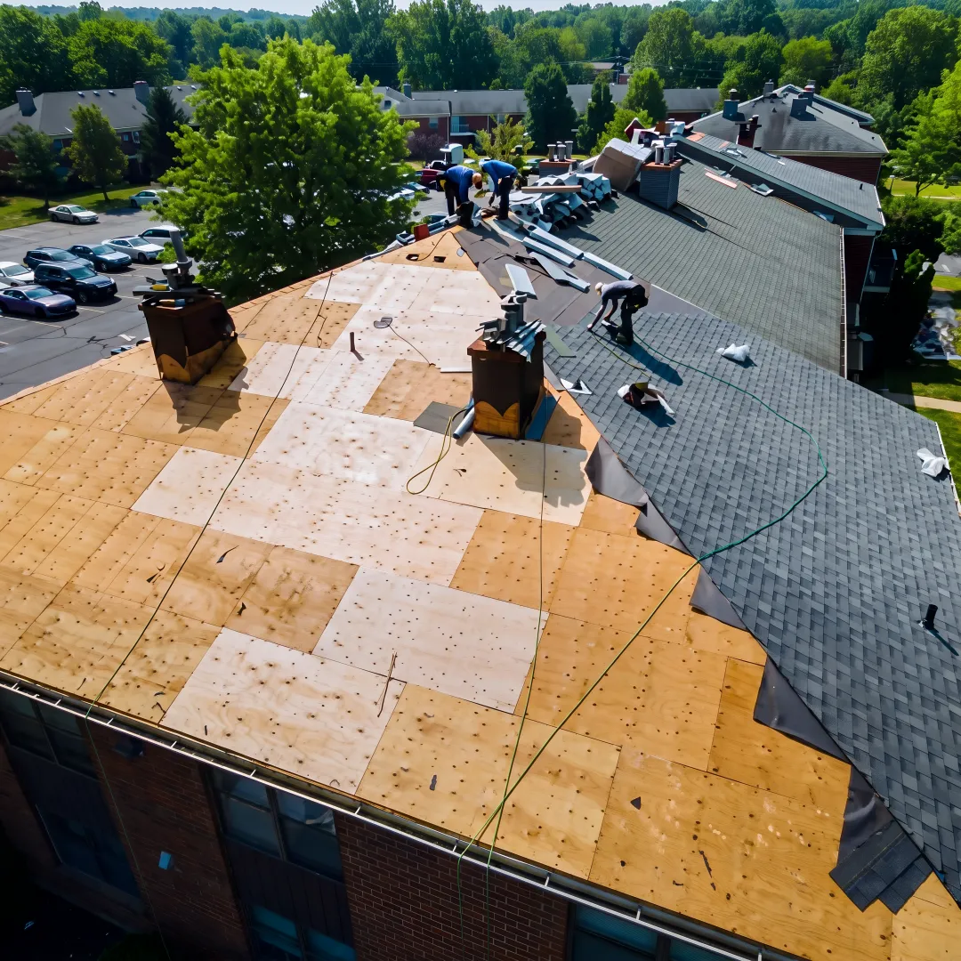 Roofer installing durable shingles