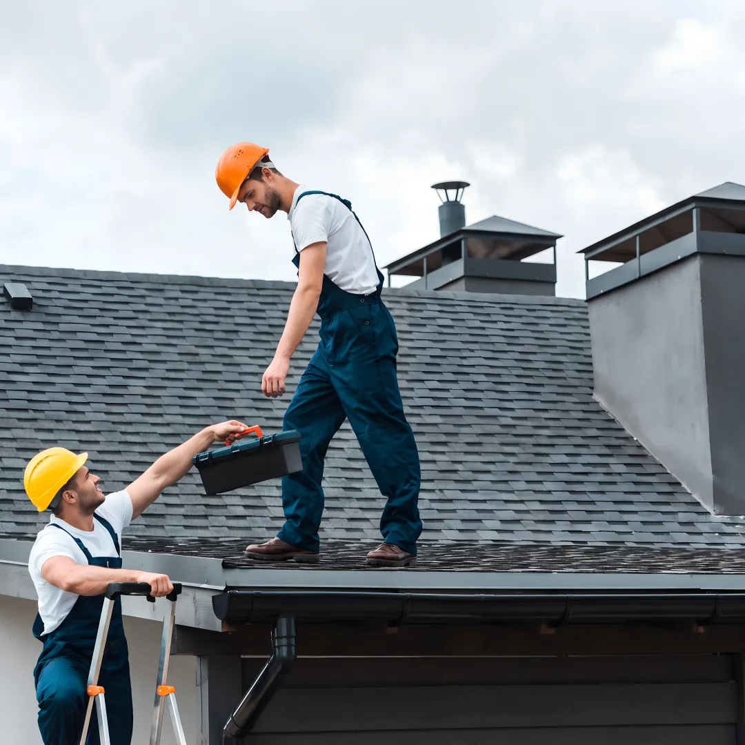 Roofer installing shingles on a Florida home