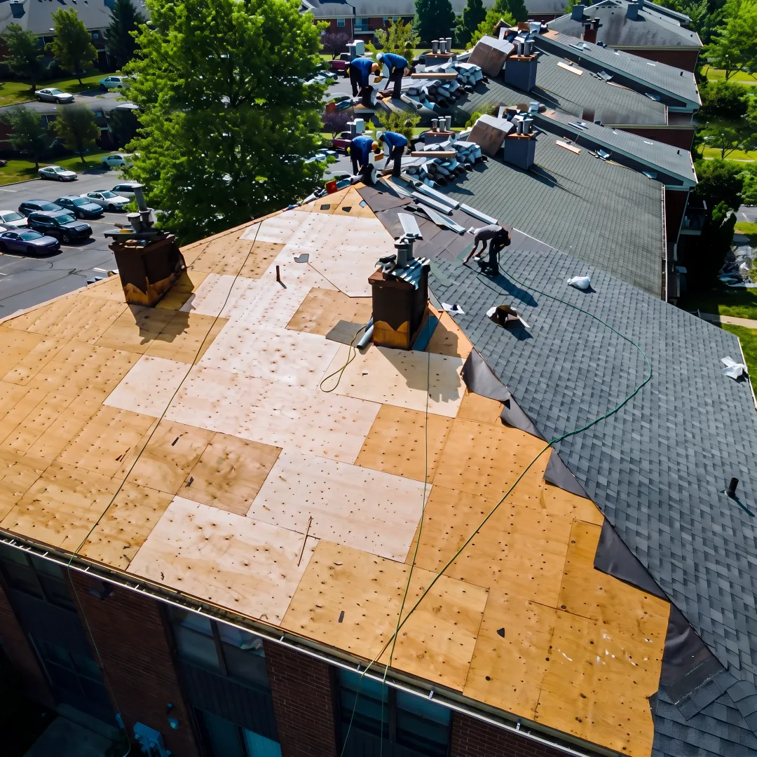 Roofing professional repairing shingles on a Florida roof
