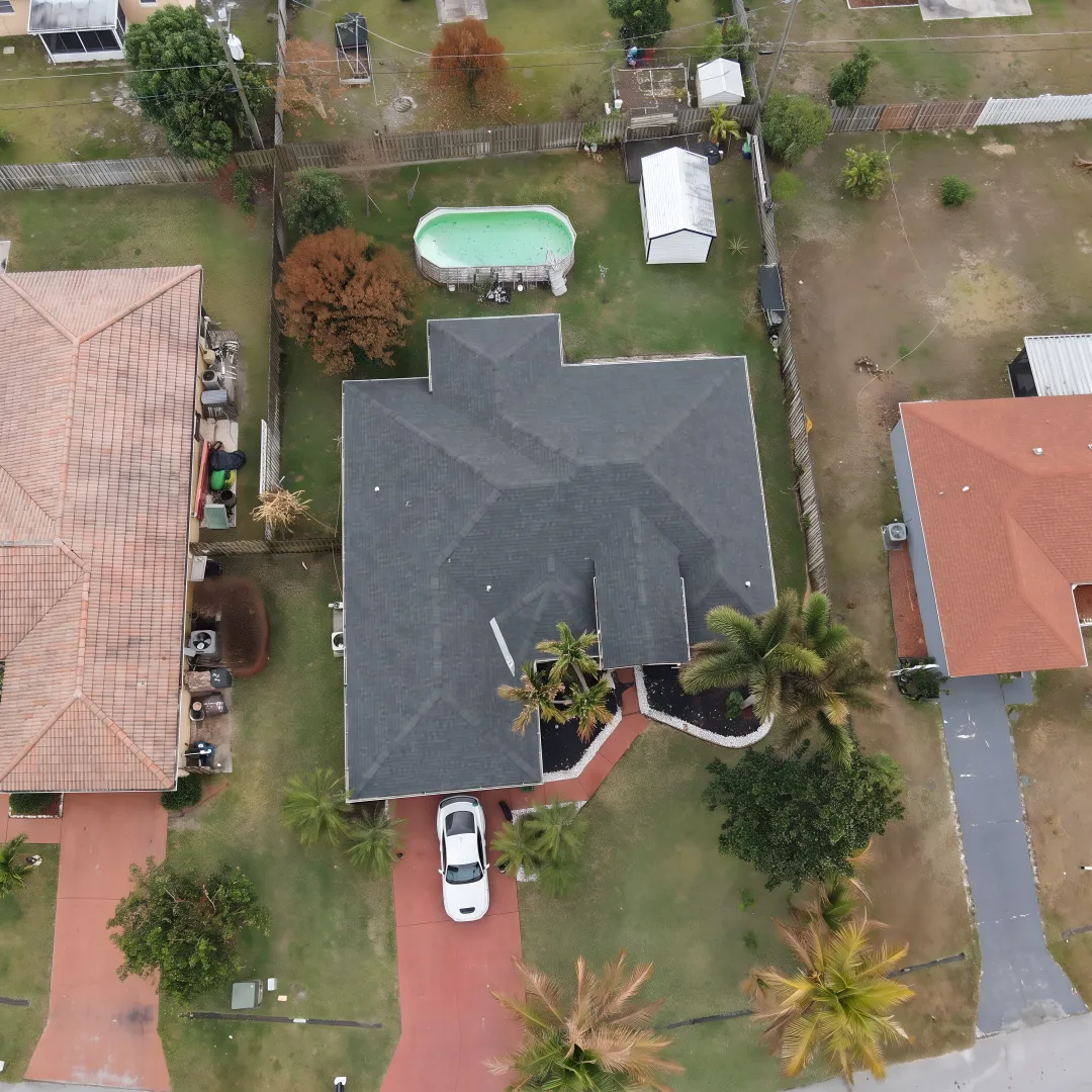 Installer inspecting a newly completed Florida roof