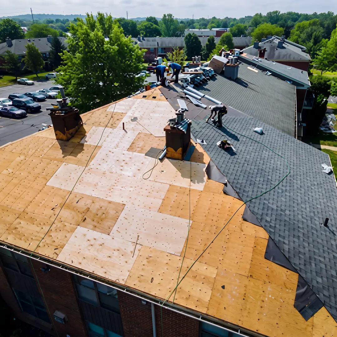 Roofing technician repairing damaged roof structure