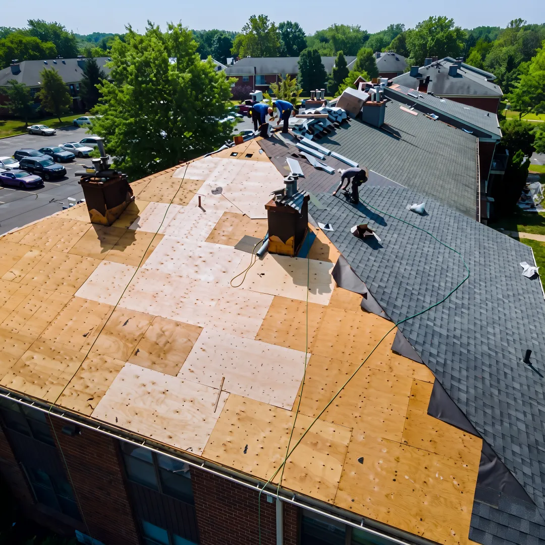 Roofers installing durable shingles