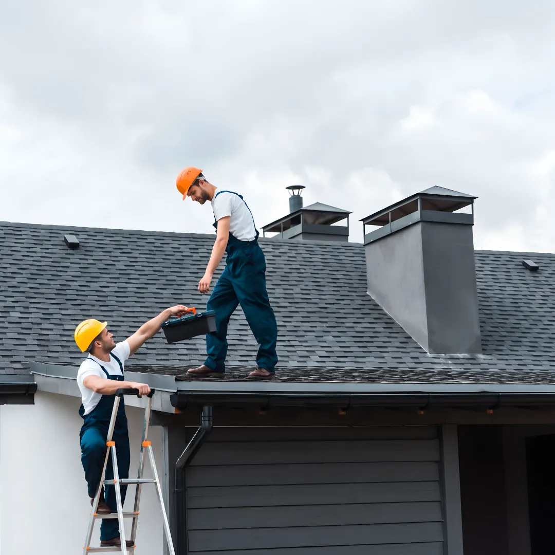 Roofing professional completing a roof repair inspection