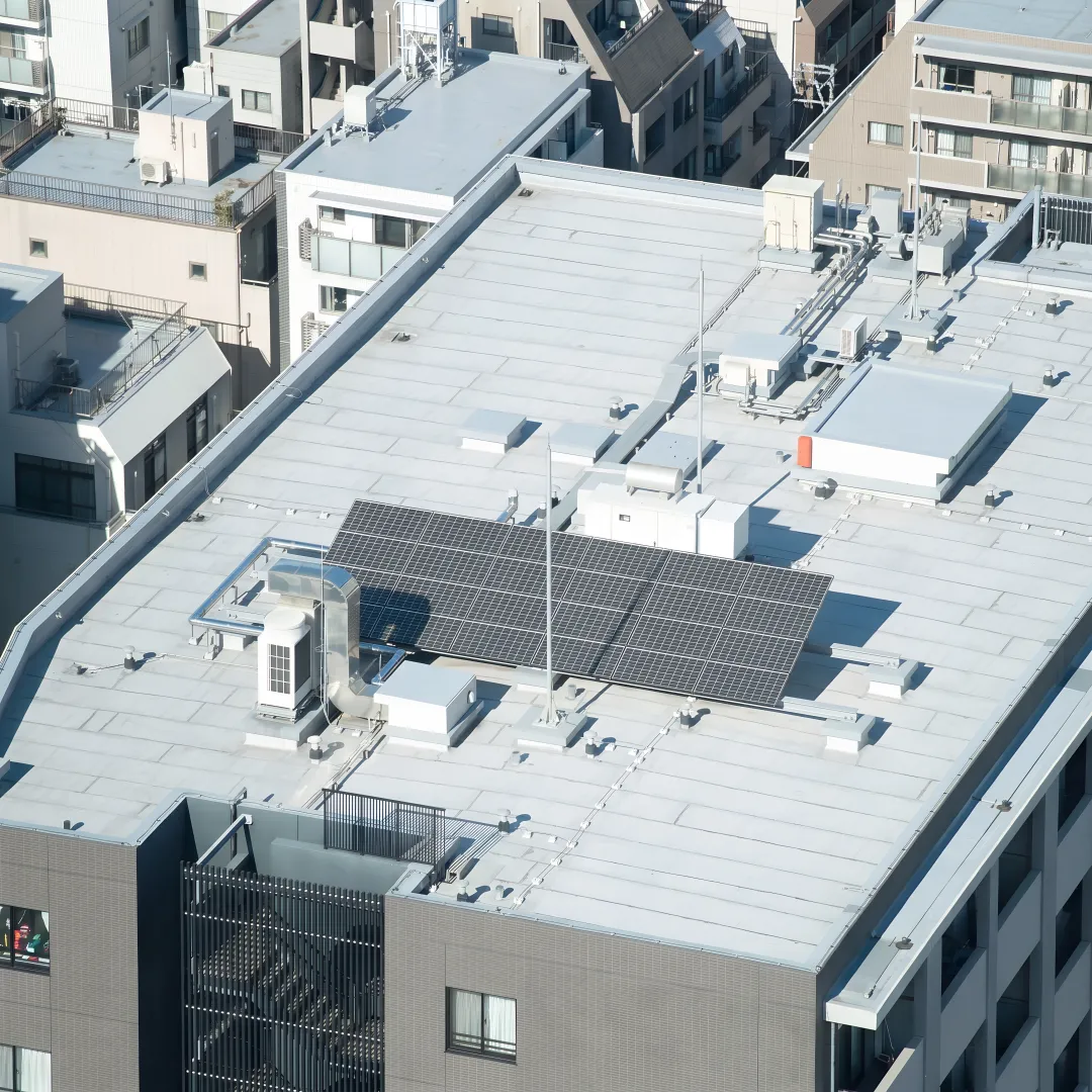 Technician reviewing a commercial roof system