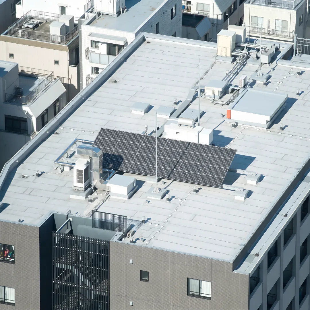 Technician inspecting a commercial roof