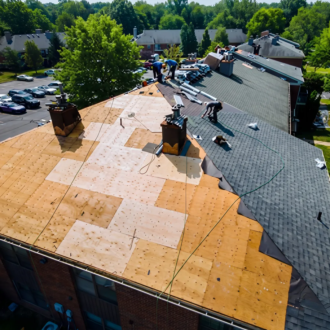 Roofing team installing shingles on a Florida home