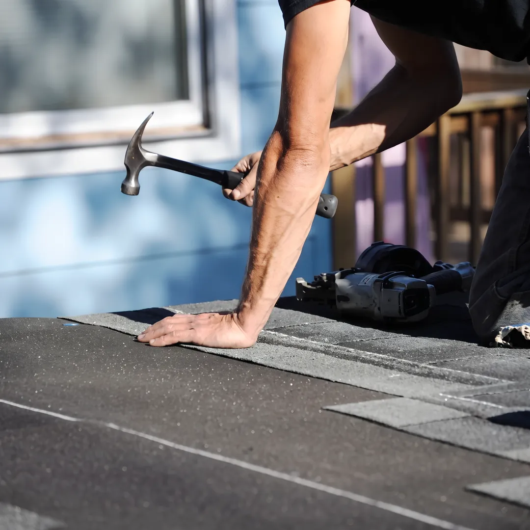 Installer inspecting a hurricane-ready roof in South Florida