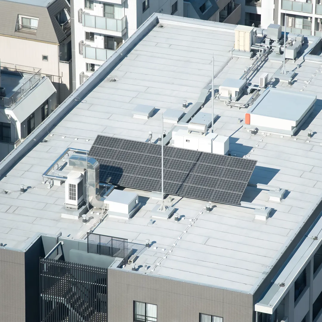 Roofing crew installing a flat roof system