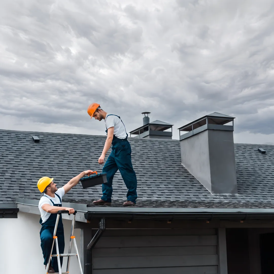 Roofing team installing storm-resistant shingles