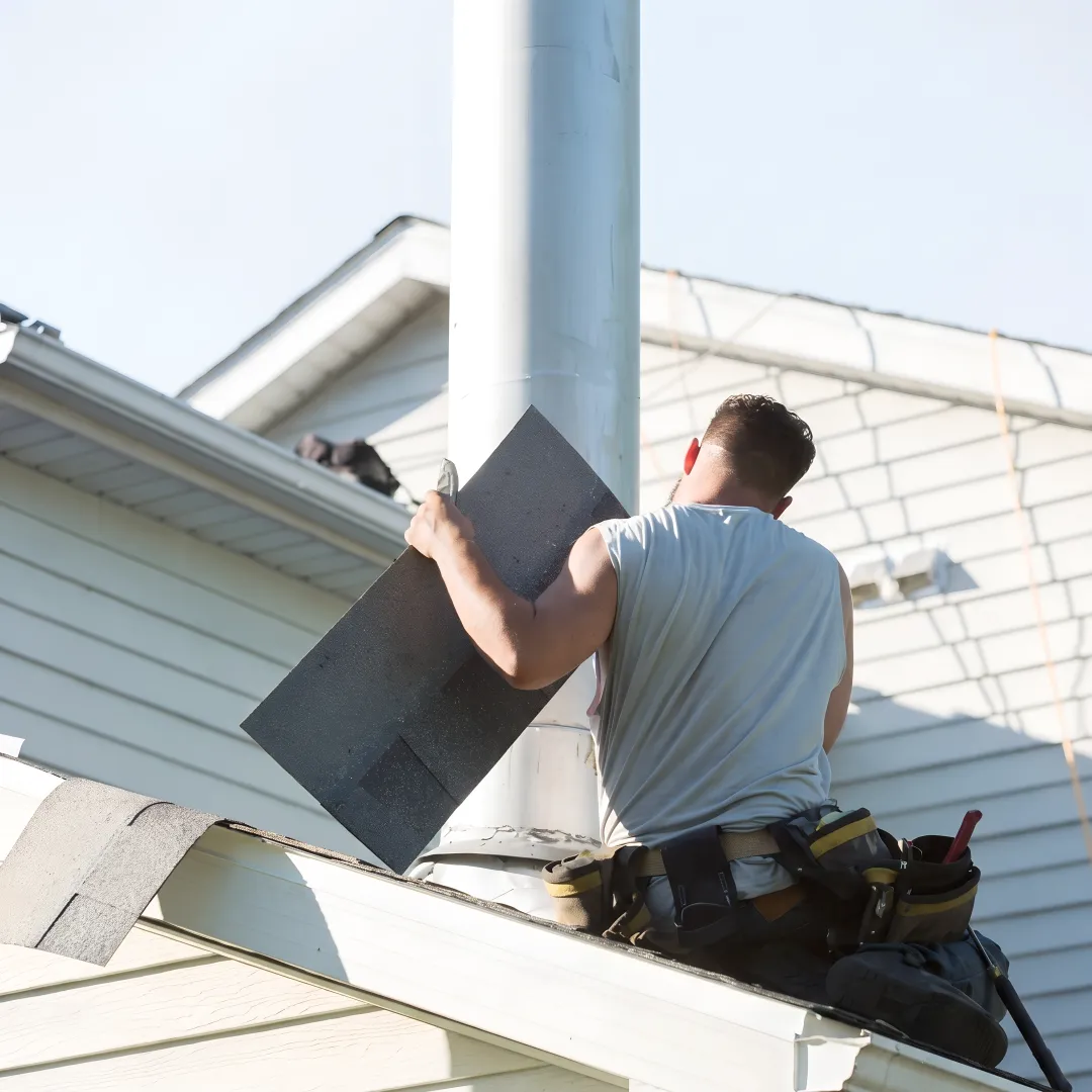 Roofing professional checking roof flashing