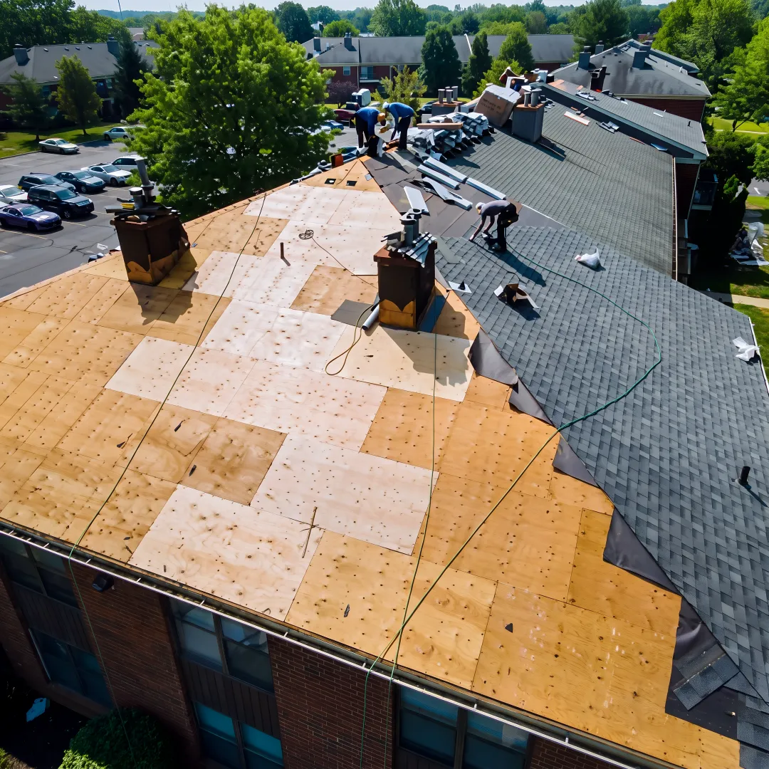 Roofing technician repairing shingles