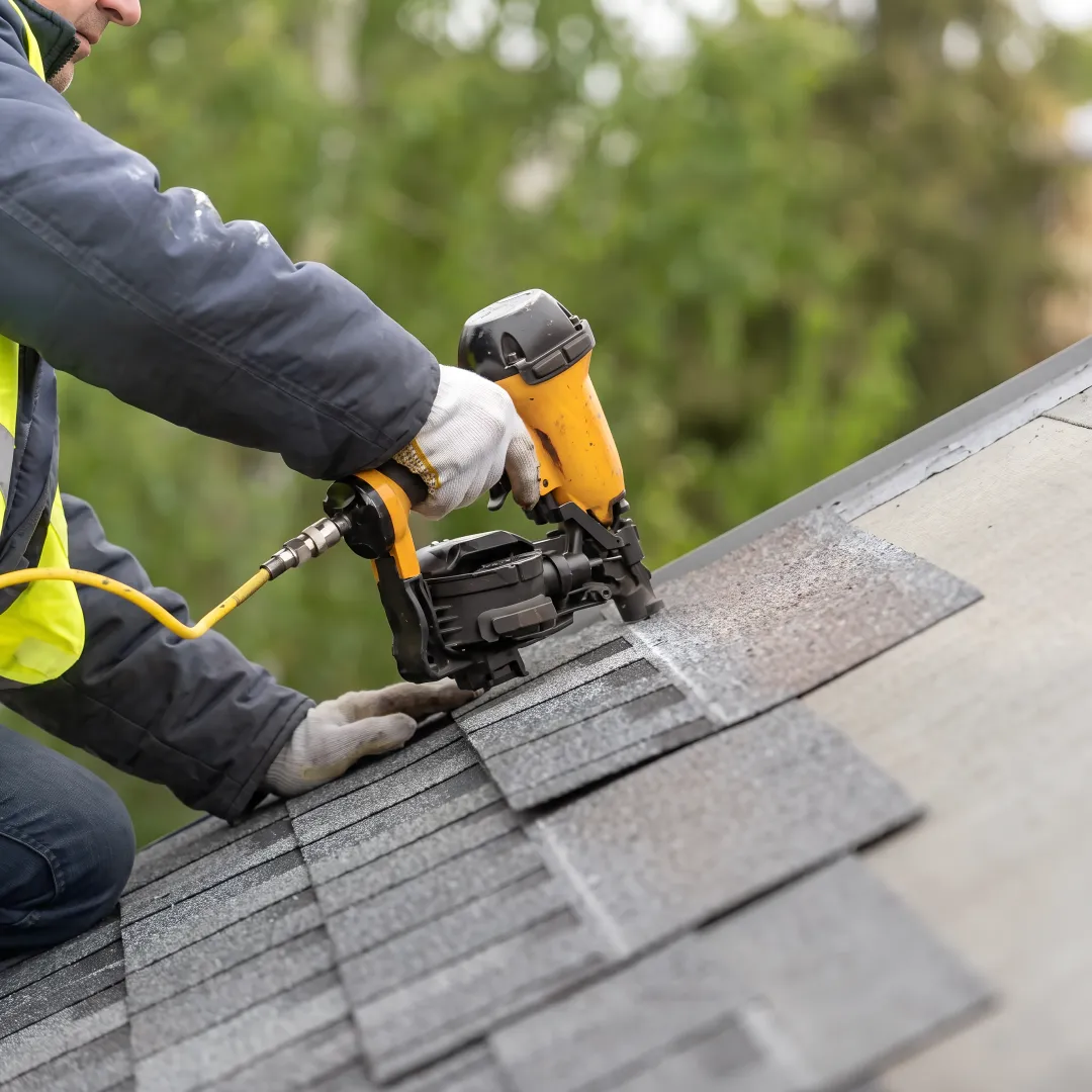Installer inspecting a newly completed roof