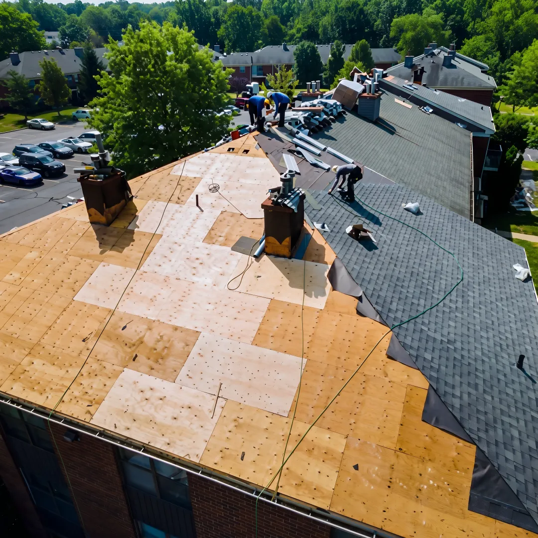 Roofing team installing durable shingles