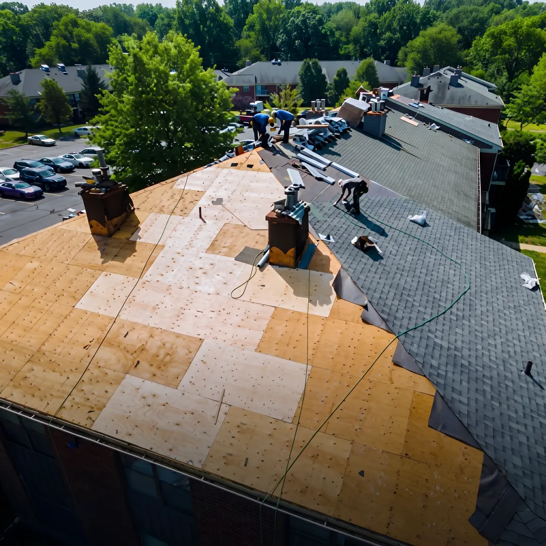 Roofer installing durable shingles
