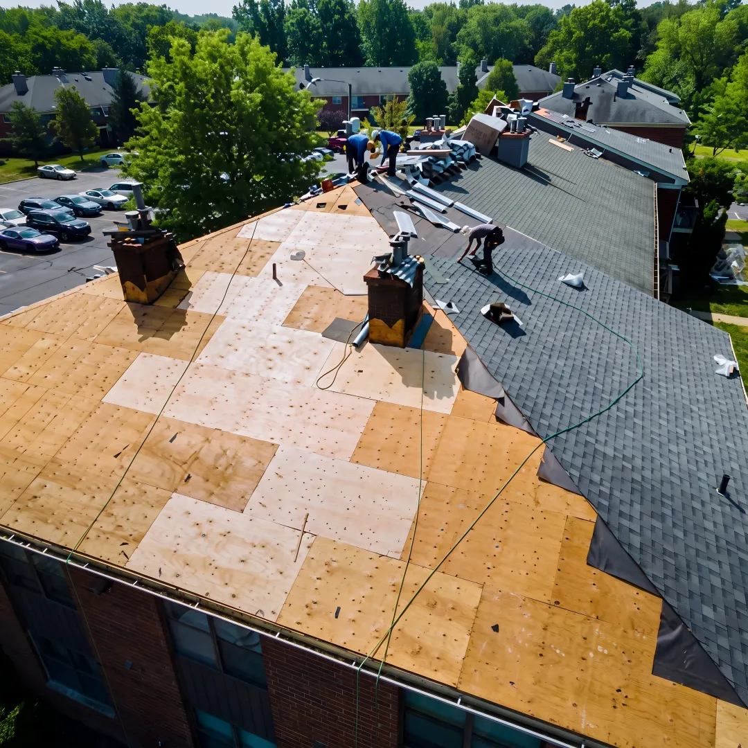 Installer preparing a roof for replacement