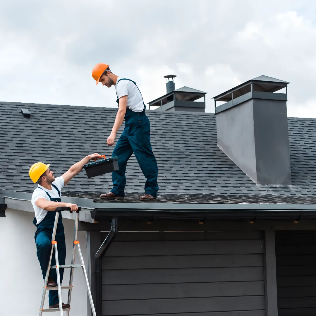 Roofing crew installing storm-resistant shingles