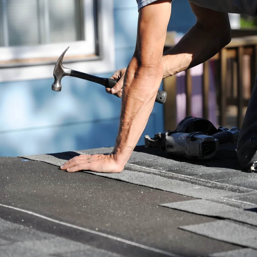 Installer inspecting a finished residential roof