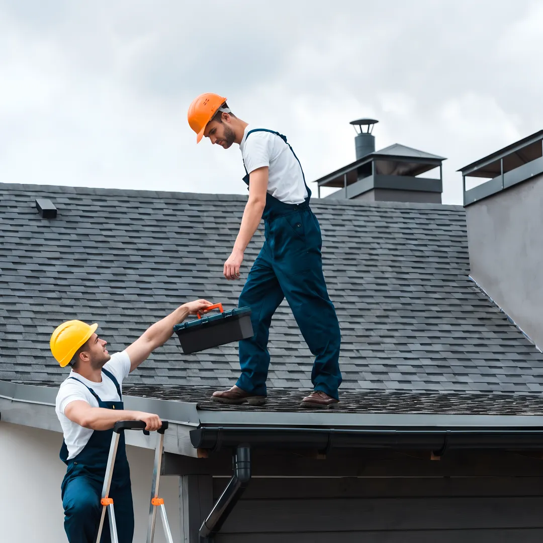 Roofing crew installing durable shingles