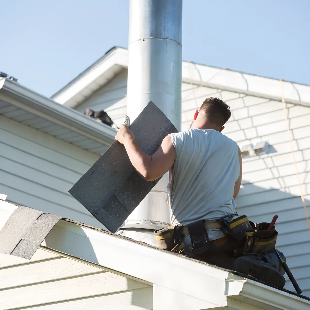 Contractor checking roof flashing