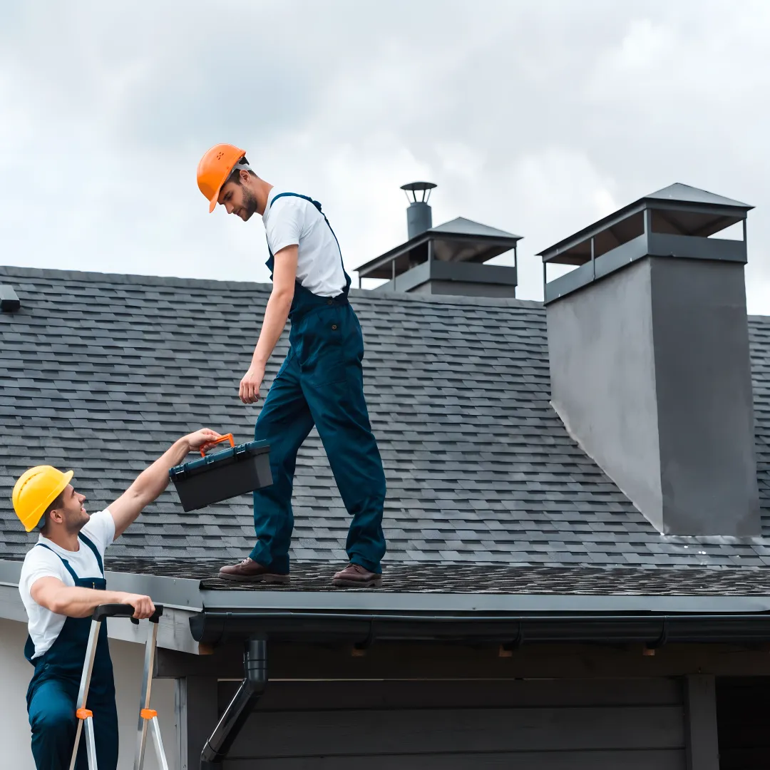 Roofer installing storm-resistant shingles
